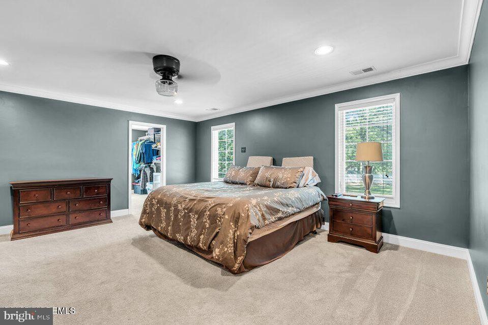 225 West Bird Village Road Jackson, NJ 08527 - Photo 29 of 66 a spacious bedroom with a bed and a dresser