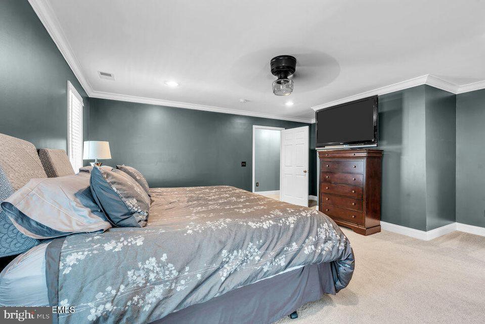 225 West Bird Village Road Jackson, NJ 08527 - Photo 30 of 66 a bedroom with a bed and a television in it