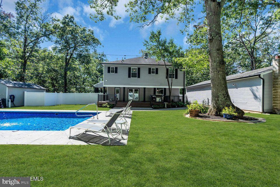 225 West Bird Village Road Jackson, NJ 08527 - Photo 51 of 66 a view of a house with a yard and sitting area