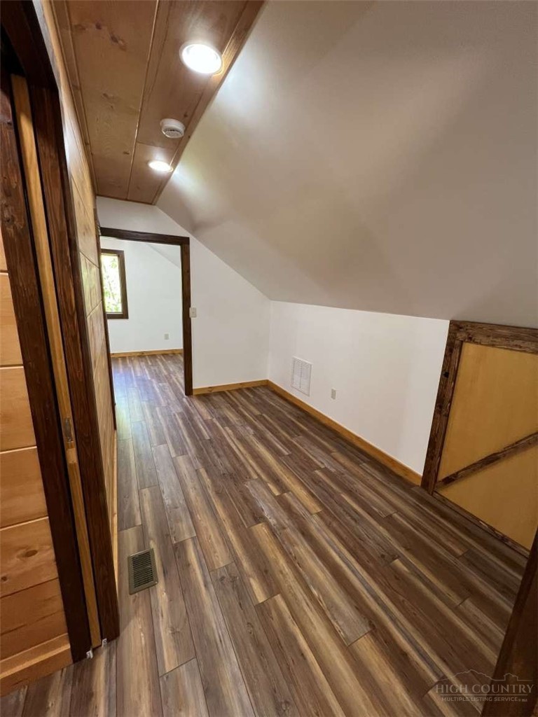 138 Talon Drive Boone, NC 28607 - Photo 16 of 25 a view of empty room with wooden floor