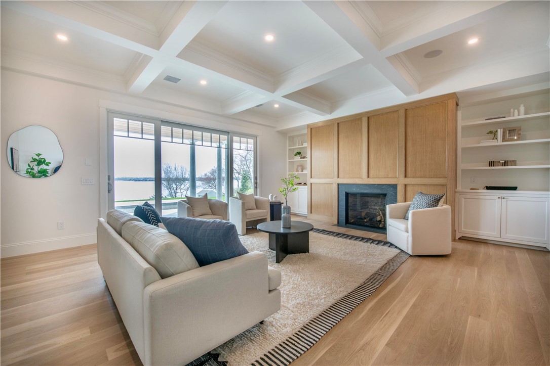 19 Sea Ridge Drive Narragansett, RI 02874 - Photo 33 of 41 Lower level family room with fireplace and walk-out to patio, pool, barbecue area