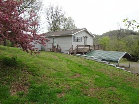 706 Center Point Road Pulaski, TN 38478 - Photo 3 of 20 a view of a house with a yard and sitting area