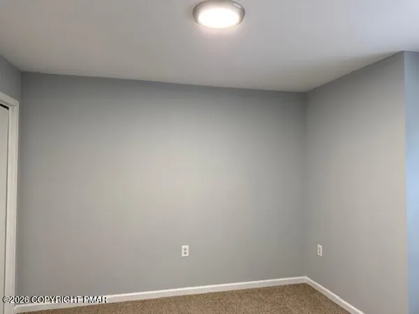 a bathroom with a toilet and a bathtub