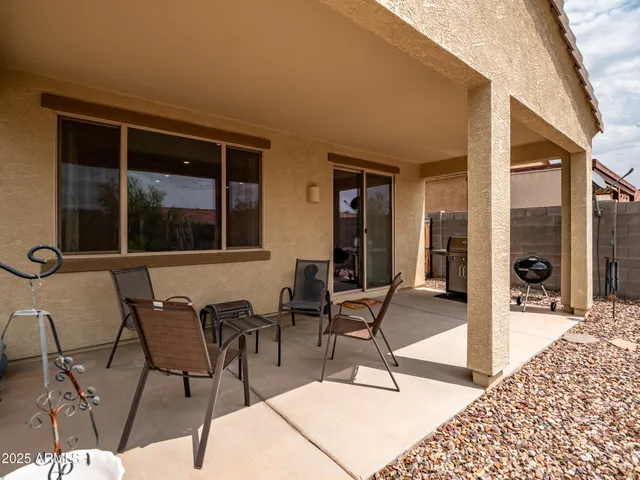 a outdoor space with lots of chairs and mirrors