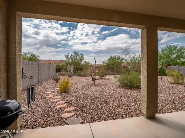 a view of a back yard from a balcony