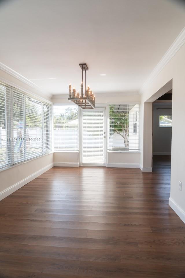 2224 Tinker Street Port Charlotte, FL 33948 - Photo 11 of 42 a view of empty room with wooden floor and fan
