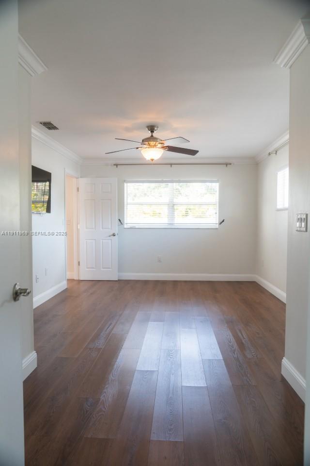 2224 Tinker Street Port Charlotte, FL 33948 - Photo 15 of 42 an empty room with wooden floor and windows