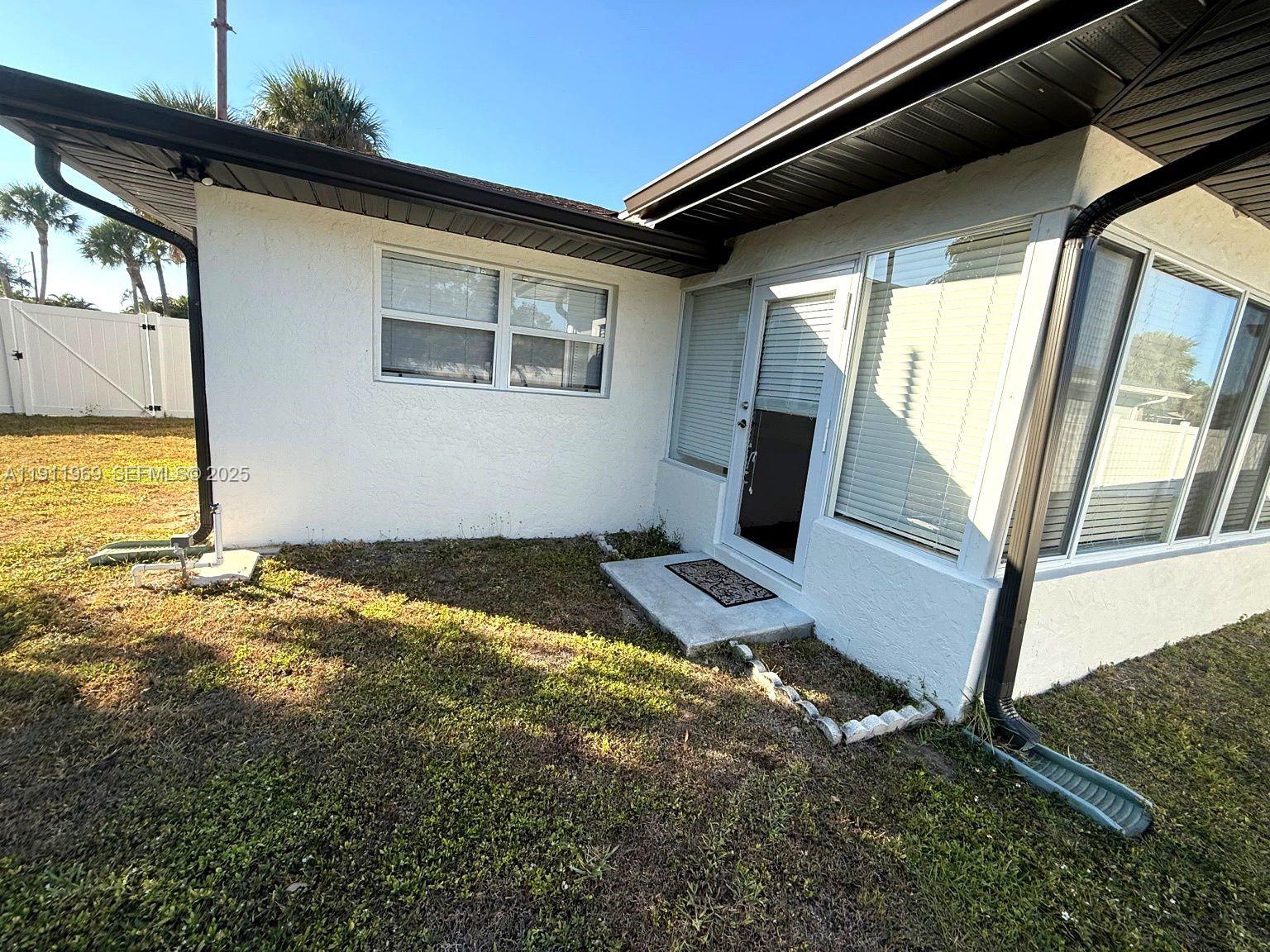 2224 Tinker Street Port Charlotte, FL 33948 - Photo 33 of 42 a view of a livingroom with wooden floor and chair