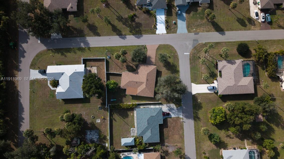 2224 Tinker Street Port Charlotte, FL 33948 - Photo 39 of 42 an aerial view of residential houses with outdoor space