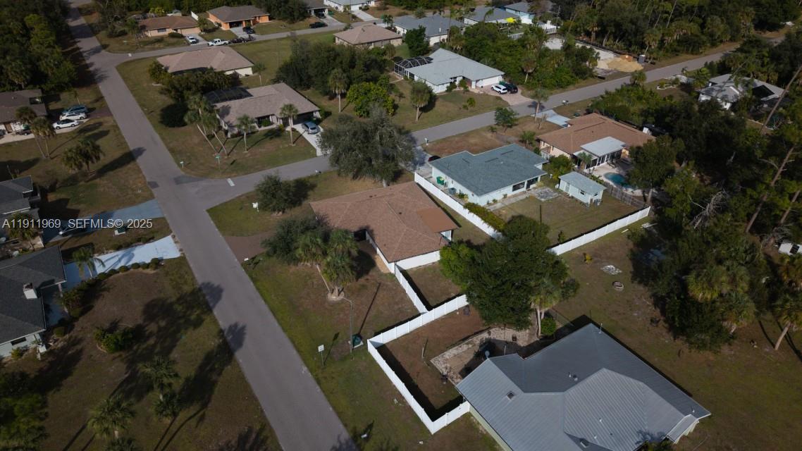 2224 Tinker Street Port Charlotte, FL 33948 - Photo 40 of 42 an aerial view of multiple houses with yard