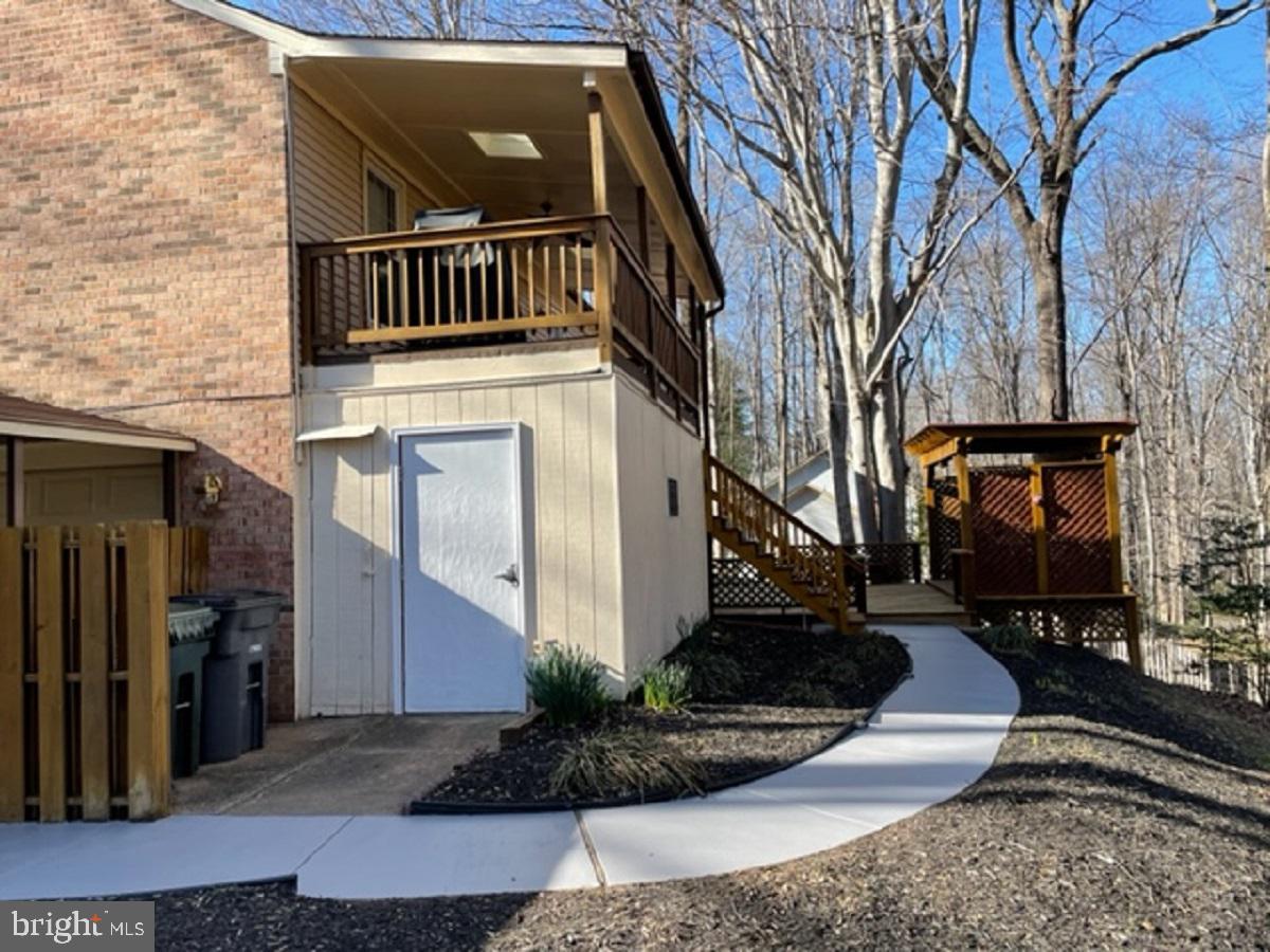 10295 Greystone Road Manassas, VA 20111 - Photo 22 of 27 Concrete walkway to deck.