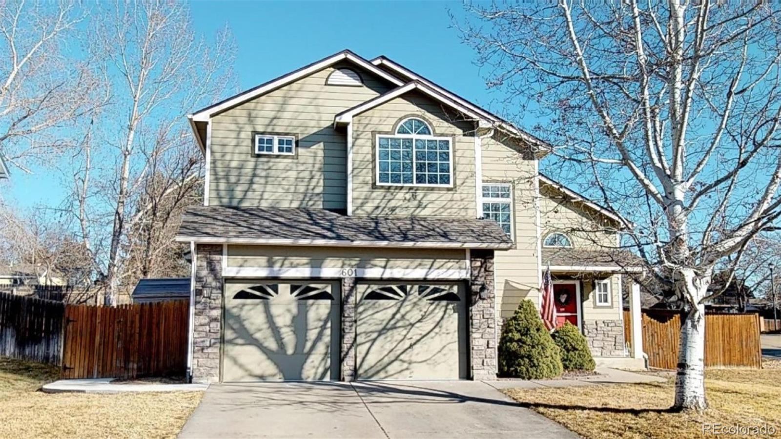 a front view of a house with parking garage