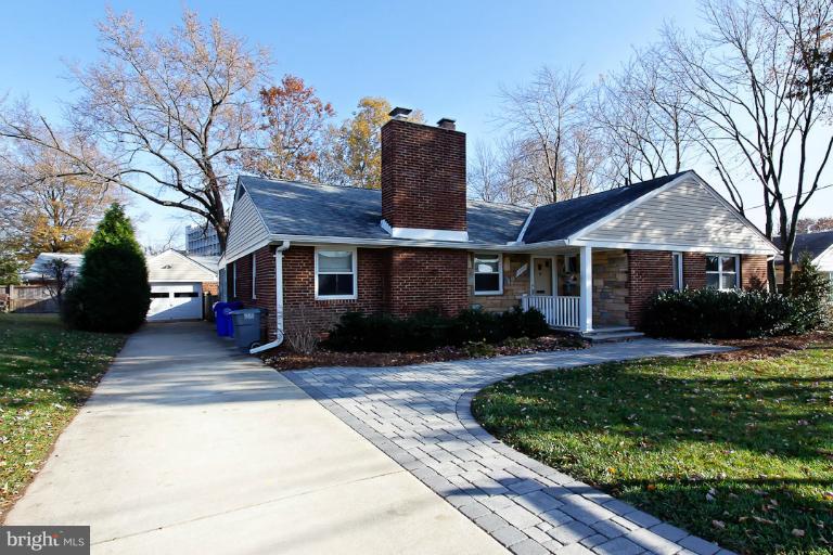 9709 Saxony Road Silver Spring, MD 20910 - Photo 20 of 24 a front view of a house with garden