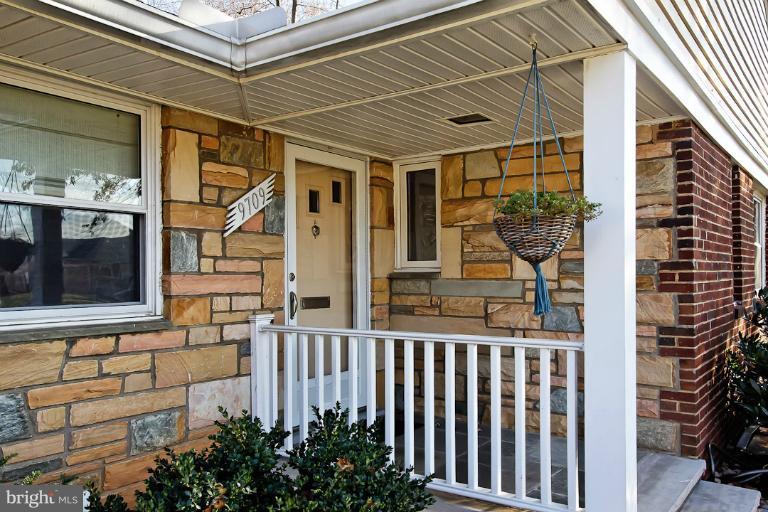 9709 Saxony Road Silver Spring, MD 20910 - Photo 3 of 24 a front view of a house with a porch