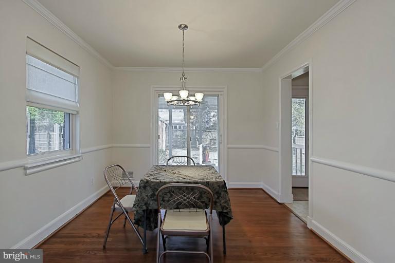 9709 Saxony Road Silver Spring, MD 20910 - Photo 8 of 24 a view of a dining room with furniture window and wooden floor