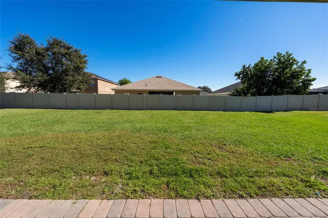 a view of sign board with flower around
