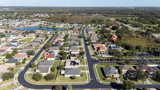 an aerial view of a house with swimming pool and outdoor space