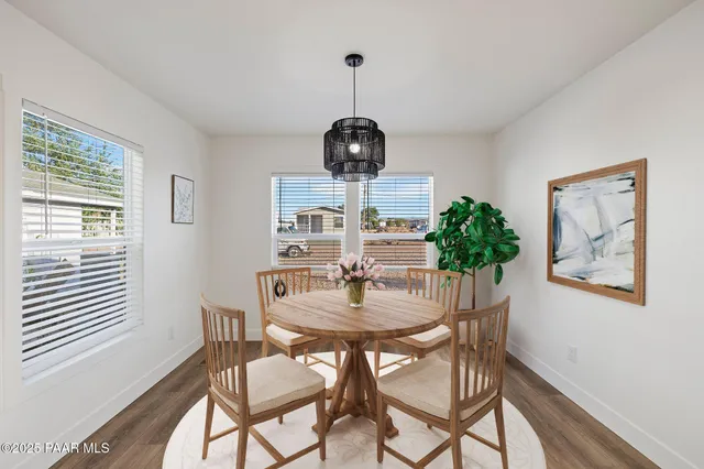 a dining room with furniture and window