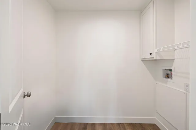 a view of walk in closet with clothes