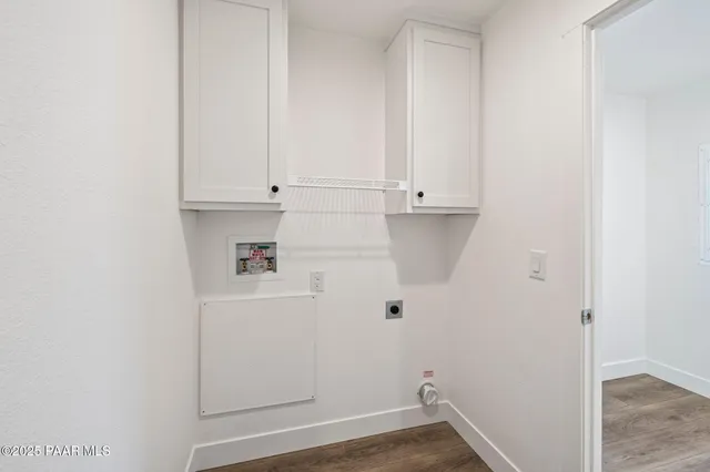 an entryway with wooden floor