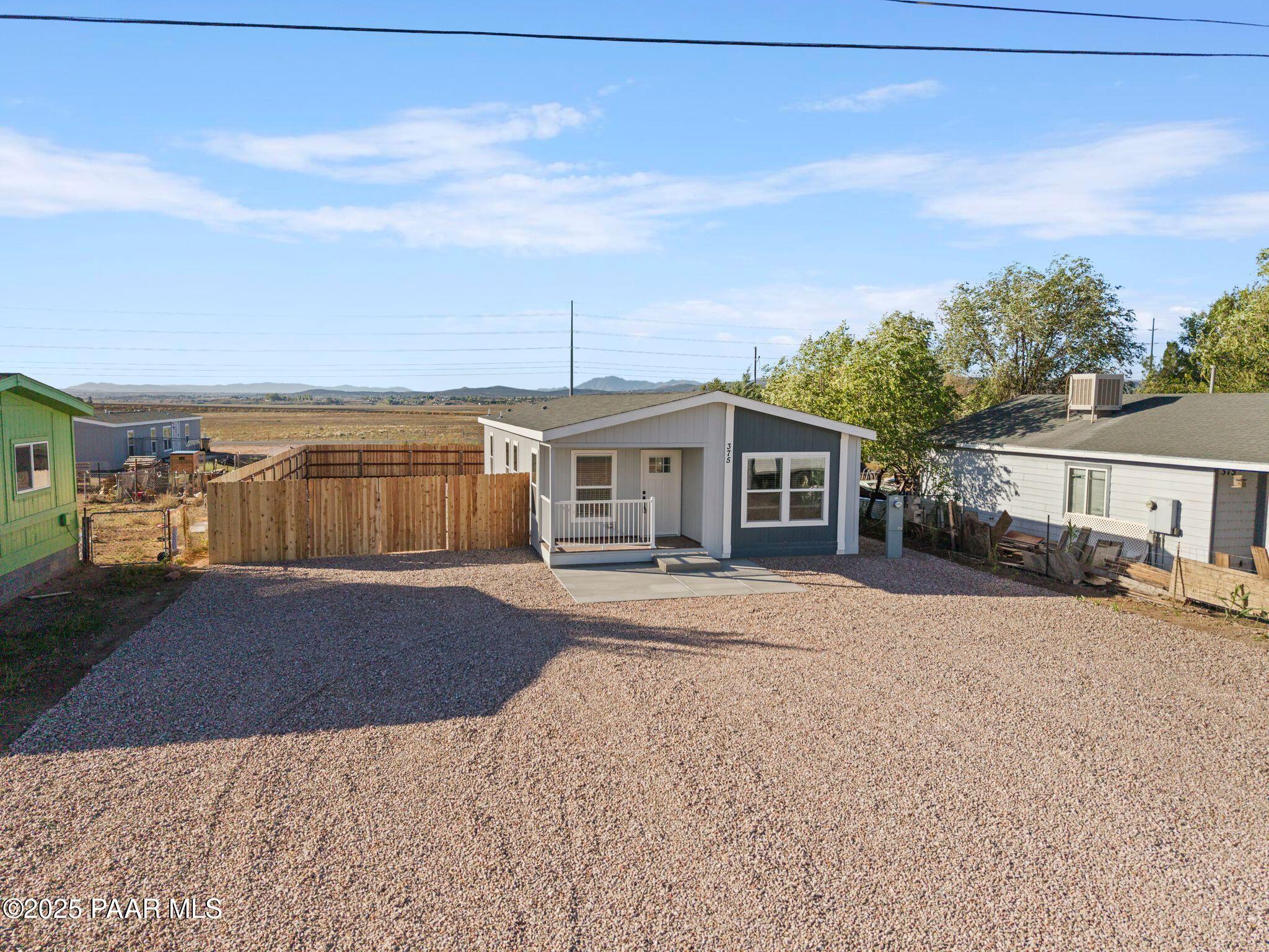 375 West Venice Way Paulden, AZ 86334 - Photo 3 of 41 a front view of a house with a yard and garage