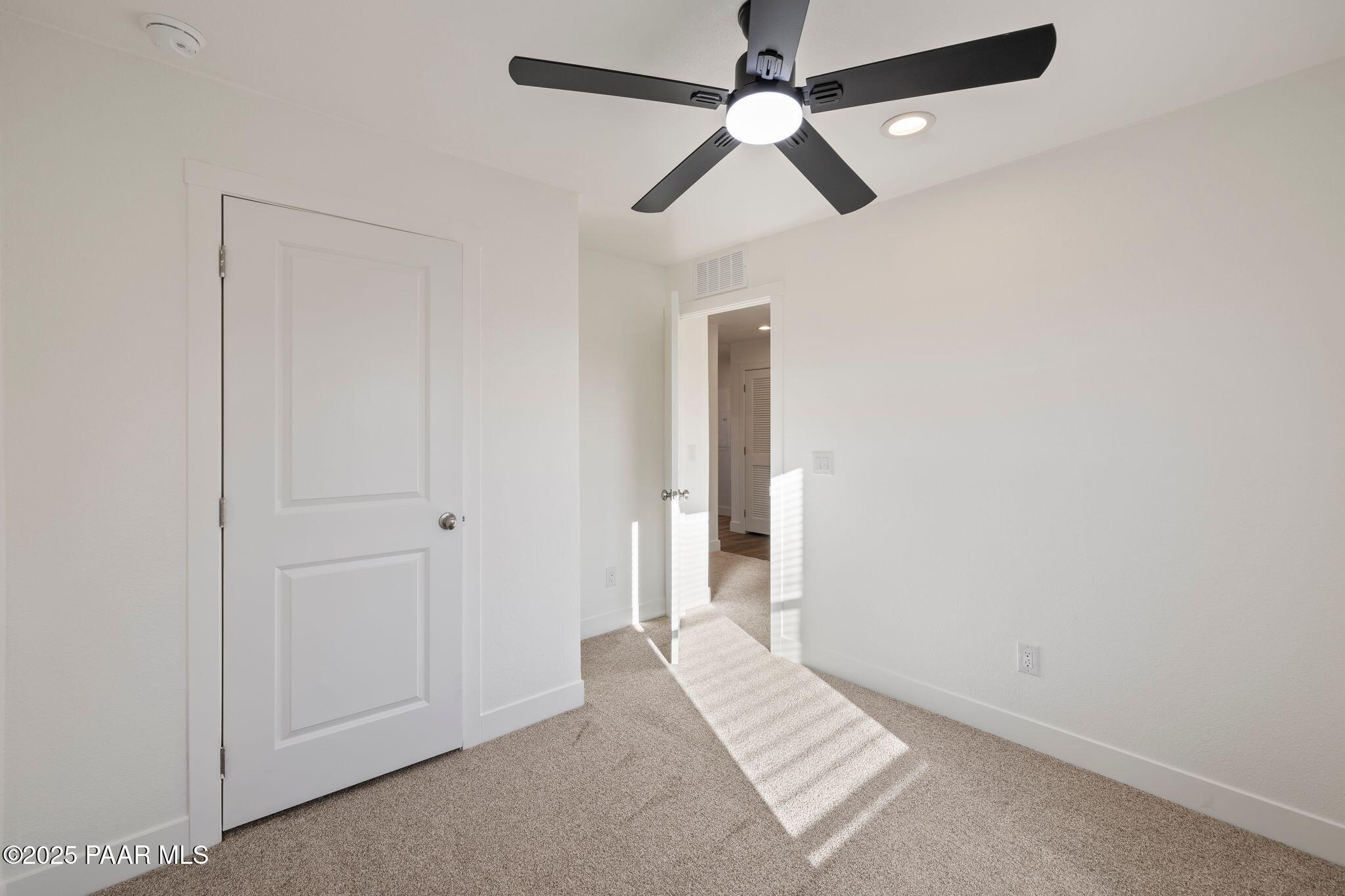 375 West Venice Way Paulden, AZ 86334 - Photo 33 of 41 an empty room with closet and a ceiling fan