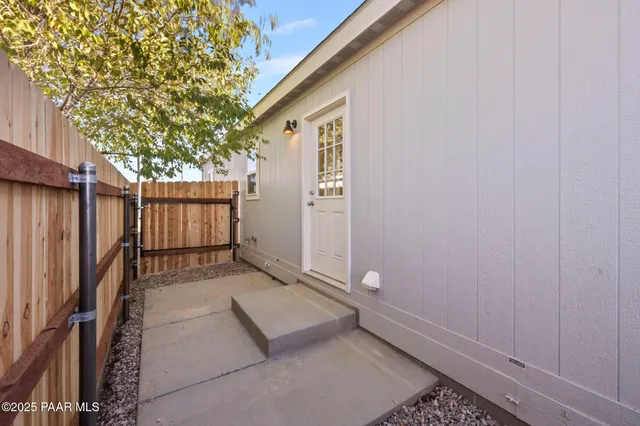 a view of small space with wooden floor and backyard