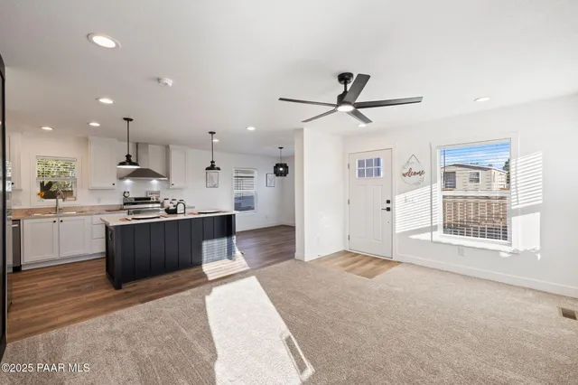 a kitchen with a refrigerator and a sink