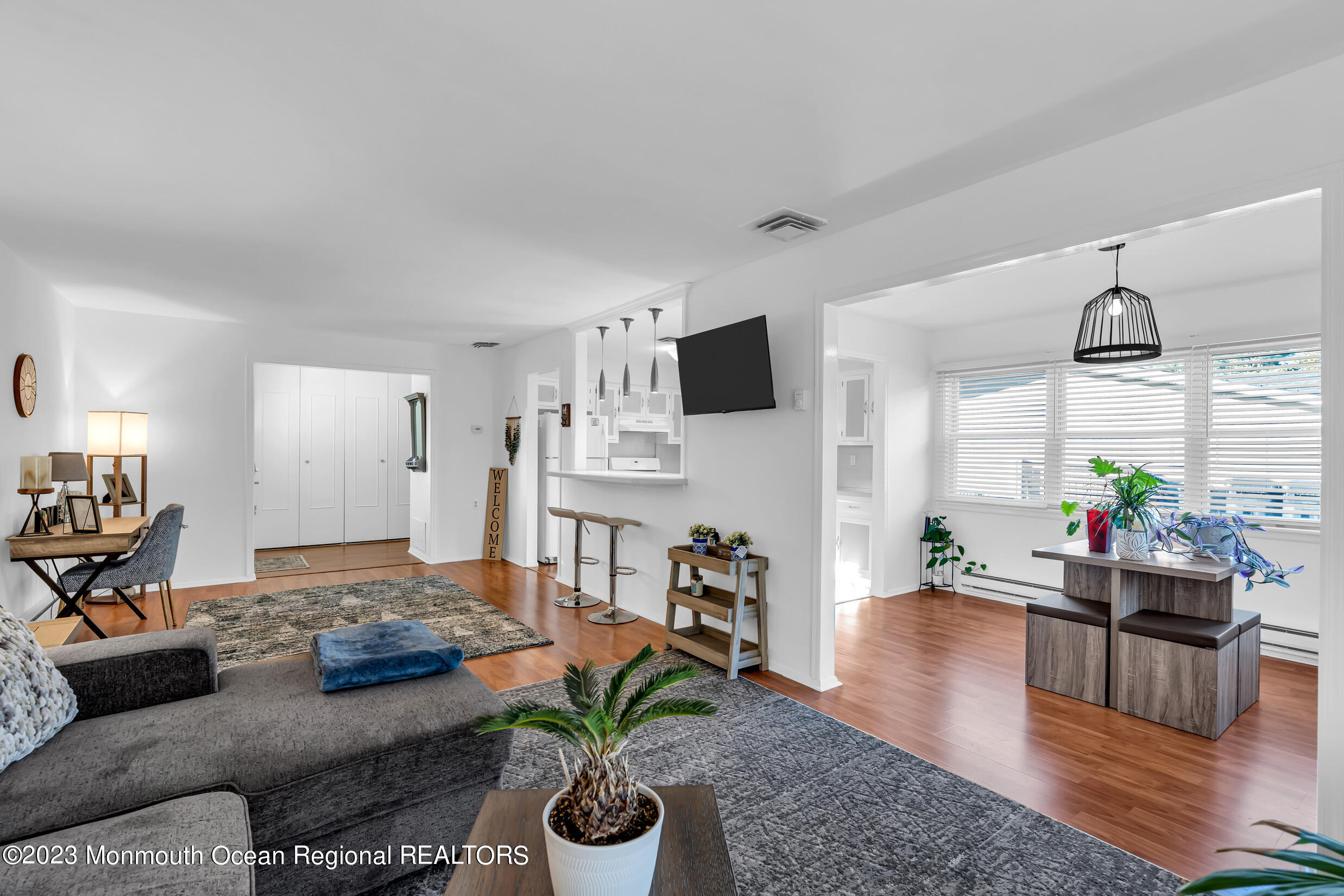 18 Poe Road Brick, NJ 08724 - Photo 12 of 28 a living room with furniture kitchen view and a potted plant