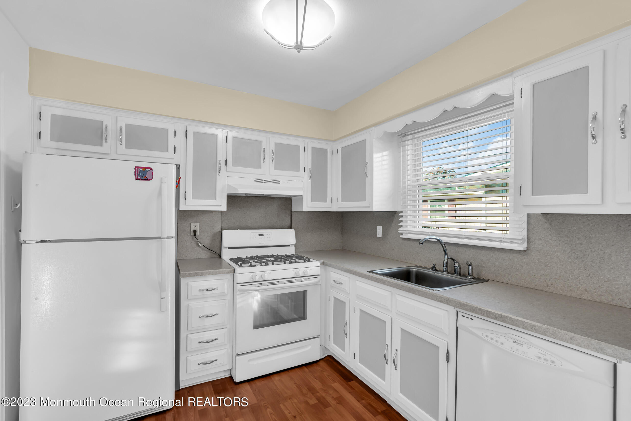 18 Poe Road Brick, NJ 08724 - Photo 17 of 28 a kitchen with white cabinets and white appliances