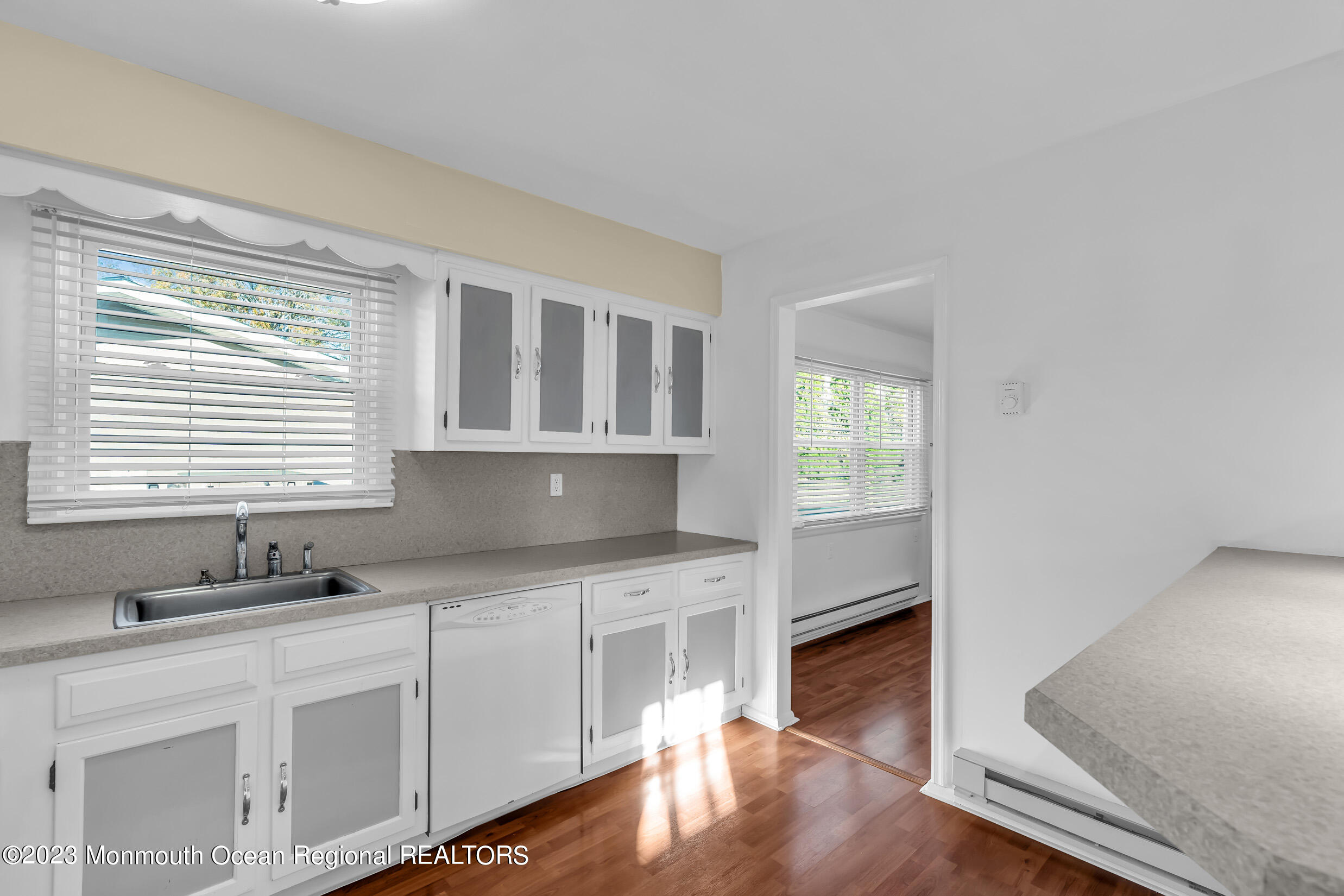 18 Poe Road Brick, NJ 08724 - Photo 19 of 28 a kitchen with wooden cabinets and a window