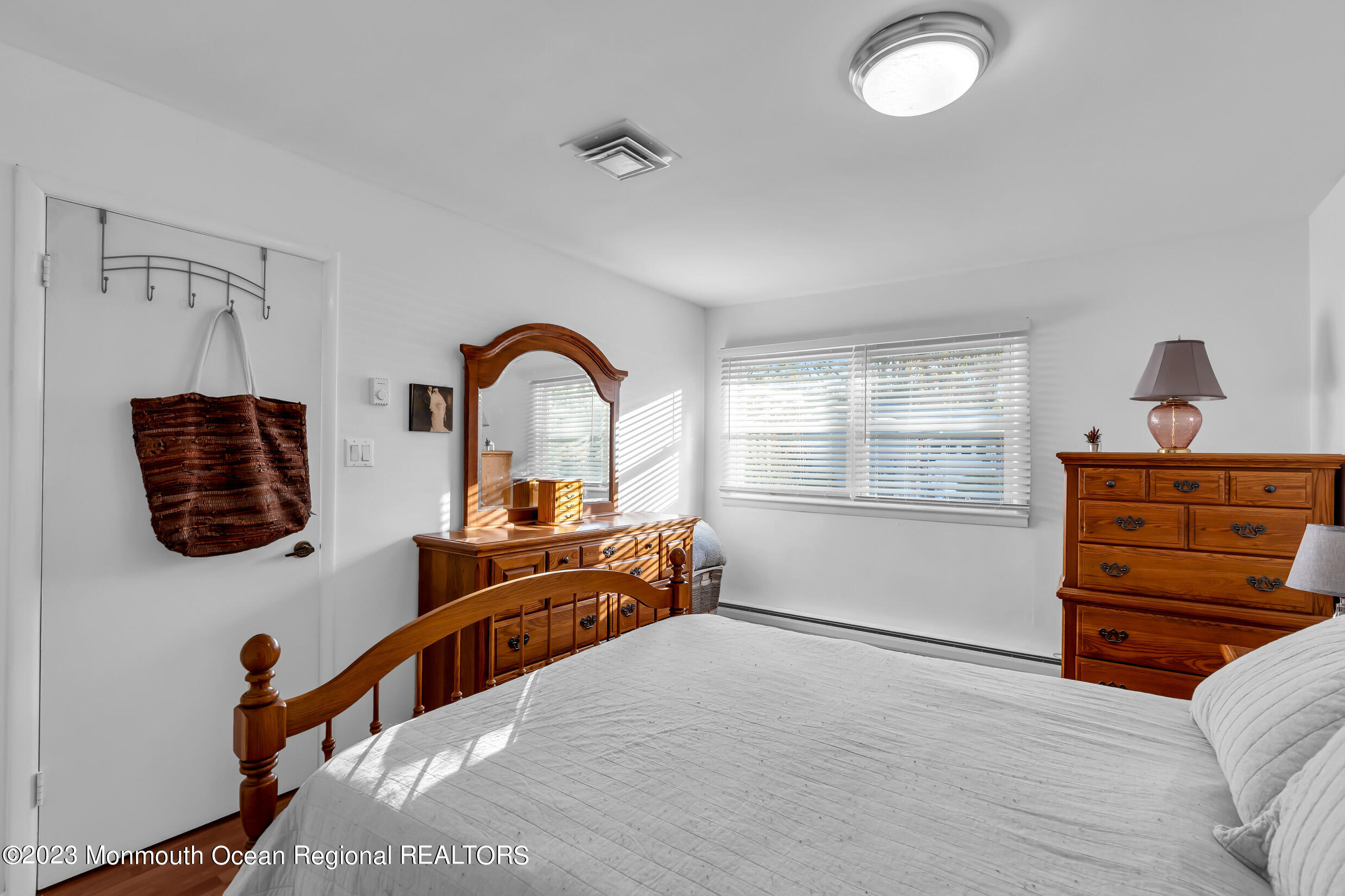 18 Poe Road Brick, NJ 08724 - Photo 22 of 28 a bedroom with a bed and wooden floor