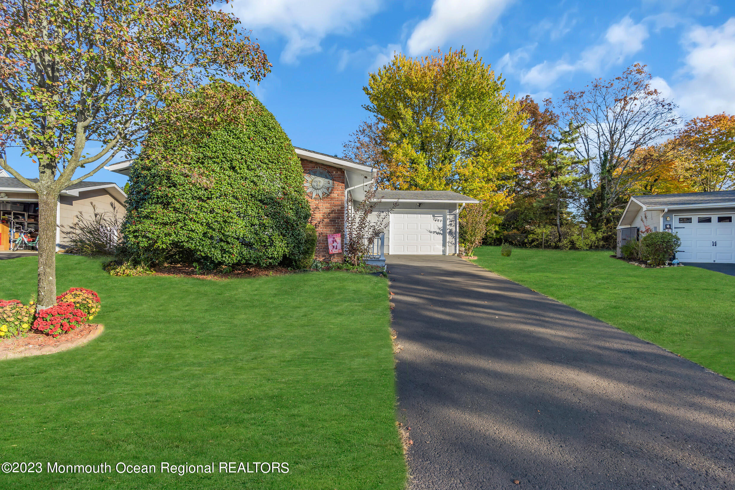 18 Poe Road Brick, NJ 08724 - Photo 5 of 28 a front view of a house with garden