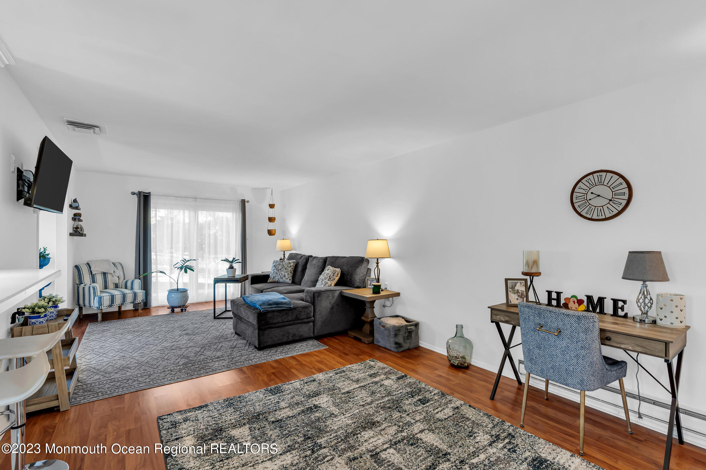 18 Poe Road Brick, NJ 08724 - Photo 8 of 28 a living room with furniture and a flat screen tv
