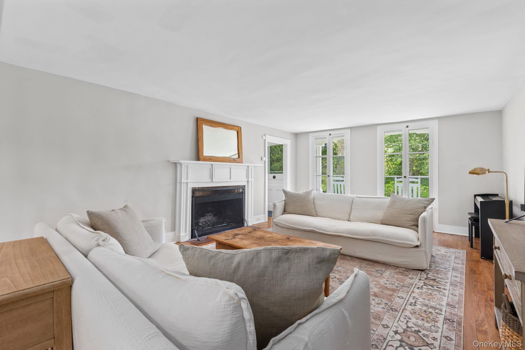 23 Pound Ridge Road Pound Ridge, NY 10576 - Photo 5 of 40 a living room with furniture and a fireplace
