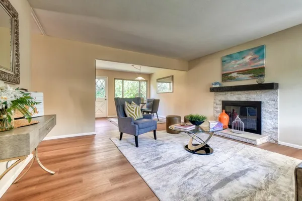 a living room with furniture and a fireplace