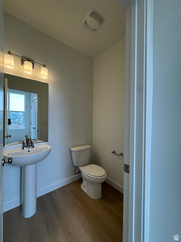 1876 West 1575th North, Unit 237 Layton, UT 84041 - Photo 9 of 20 Bathroom featuring dark wood-style floors and a textured ceiling