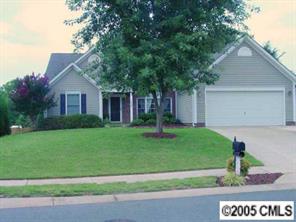 14324 Joseph Clark Road Charlotte, NC 28273 - Photo 1 of 8 a front view of a house with a yard and garage