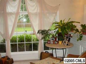 14324 Joseph Clark Road Charlotte, NC 28273 - Photo 3 of 8 a table with chairs and a potted plant