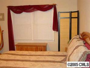 14324 Joseph Clark Road Charlotte, NC 28273 - Photo 5 of 8 a view of a bedroom with a bed and a window