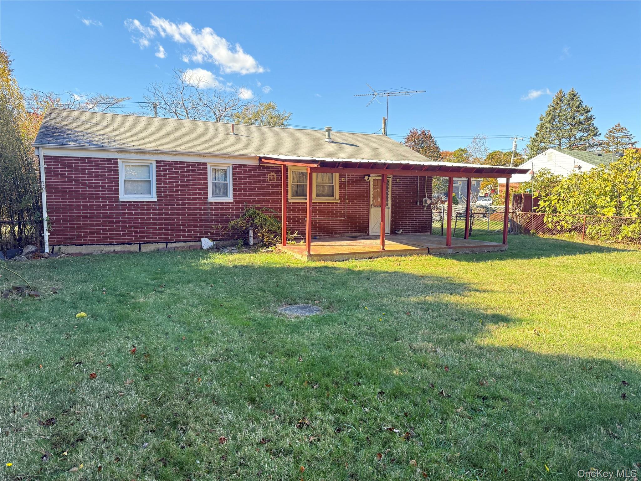 1663 North Thompson Drive Bay Shore, NY 11706 - Photo 17 of 22 a view of a house with a yard porch and sitting area