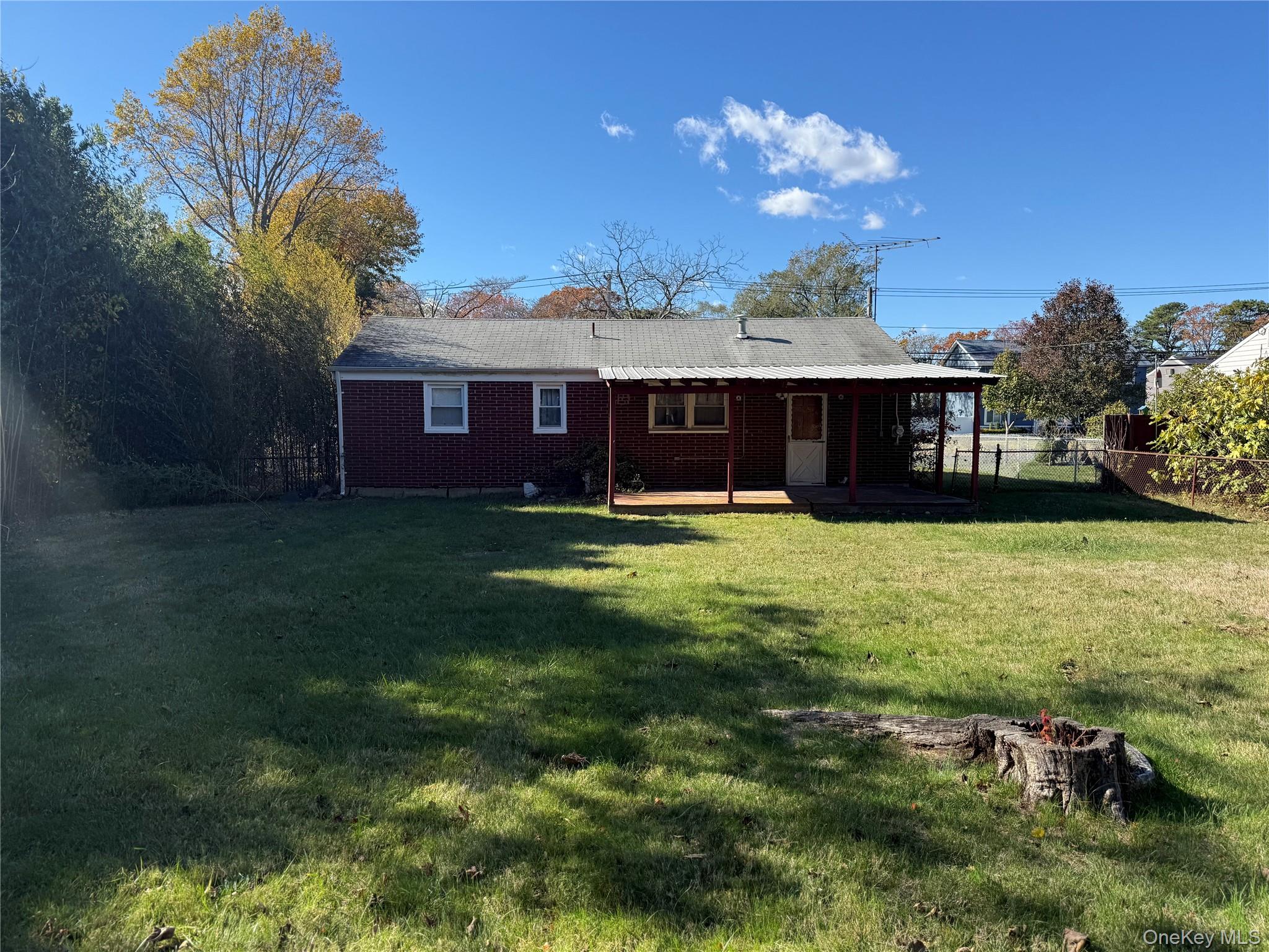 1663 North Thompson Drive Bay Shore, NY 11706 - Photo 18 of 22 a view of a house with a big yard and potted plants