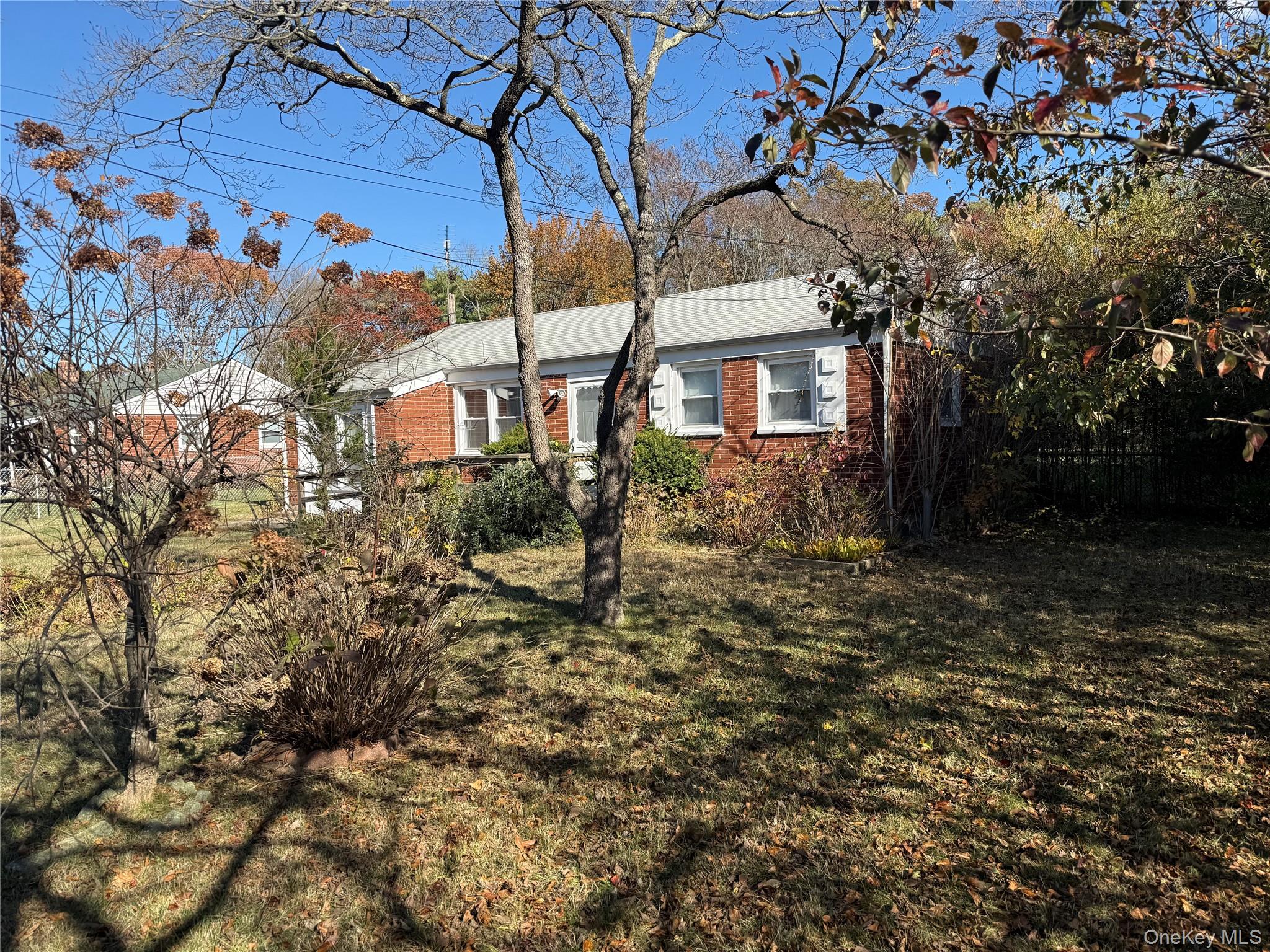 1663 North Thompson Drive Bay Shore, NY 11706 - Photo 2 of 22 a view of a house with a yard