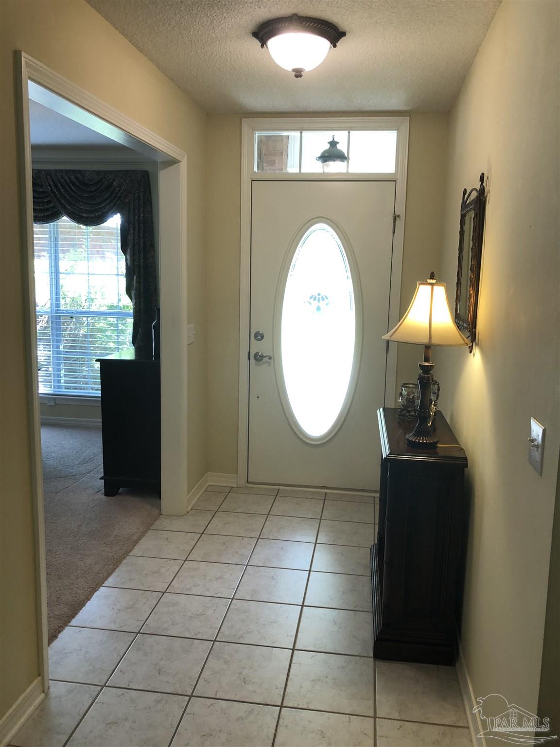 1258 Tate Road Cantonment, FL 32533 - Photo 4 of 35 Foyer with tile floor and windowed door