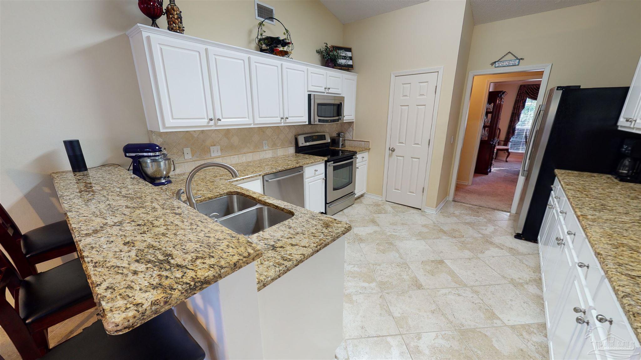 1258 Tate Road Cantonment, FL 32533 - Photo 7 of 35 Remolded kitchen, Granite, Tile, & Stainless