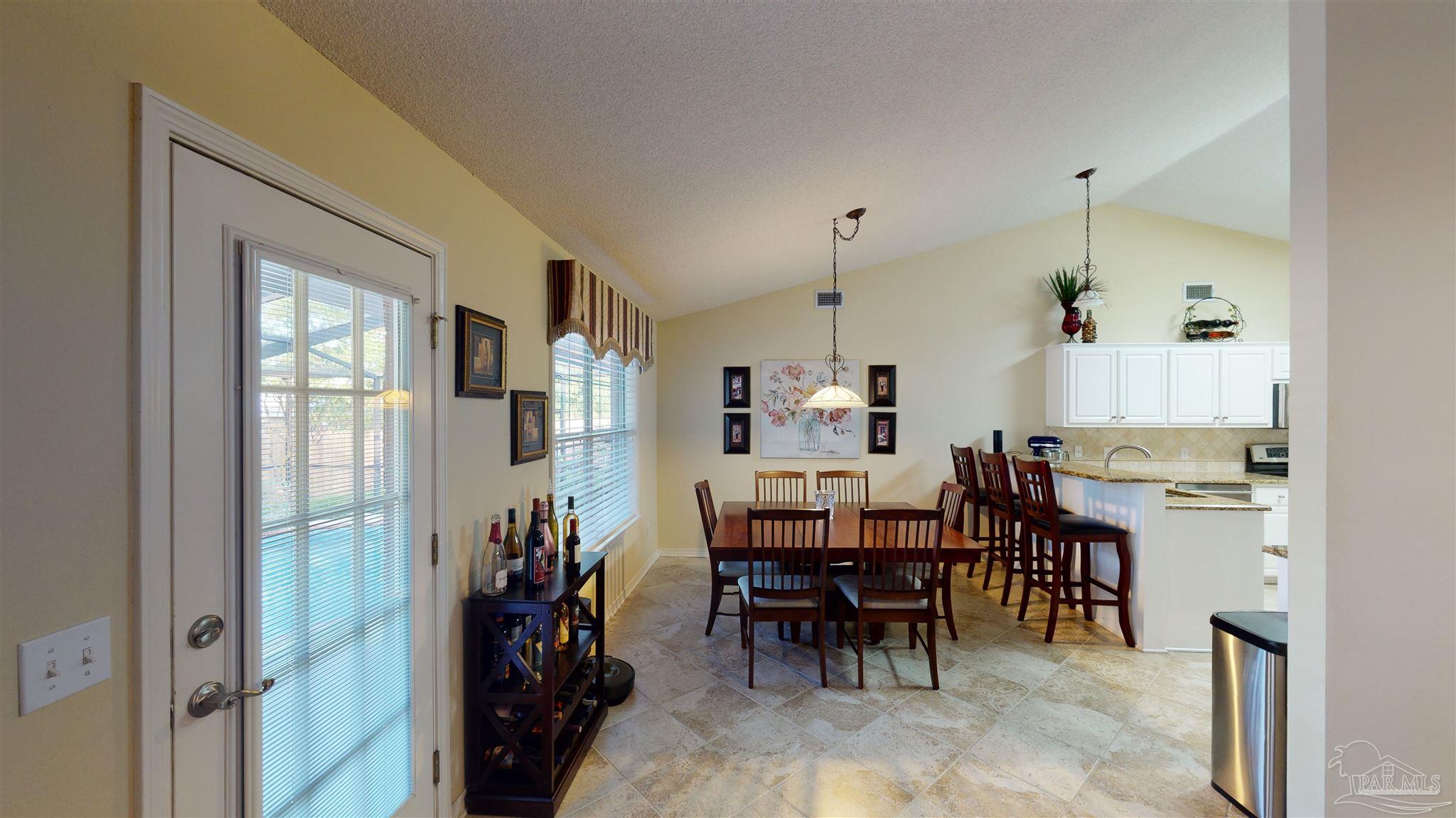 1258 Tate Road Cantonment, FL 32533 - Photo 10 of 35 Breakfast area over looking the pool, open to den