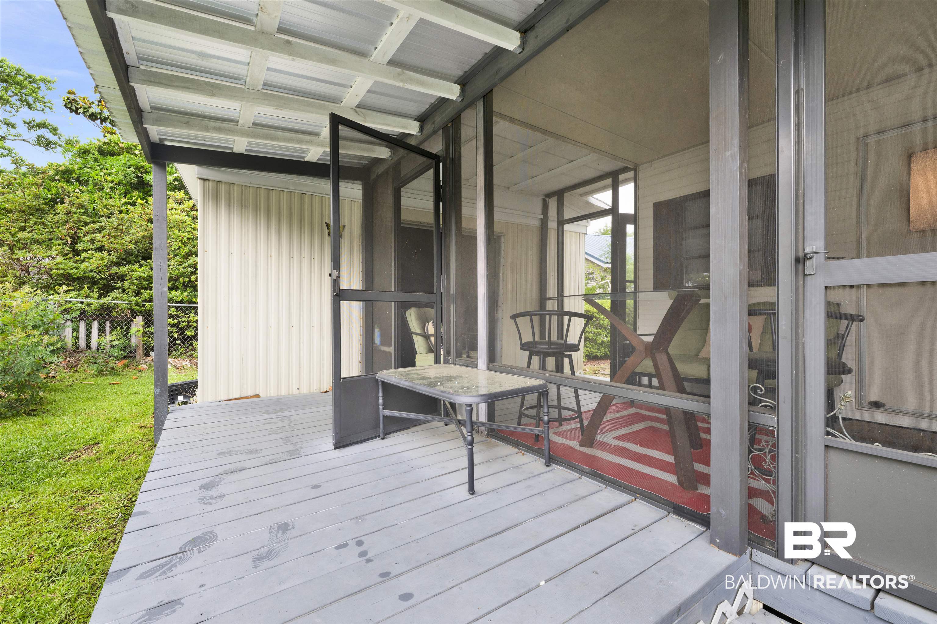 489 Elberta Loop Lillian, AL 36549 - Photo 13 of 42 Screened and open patio