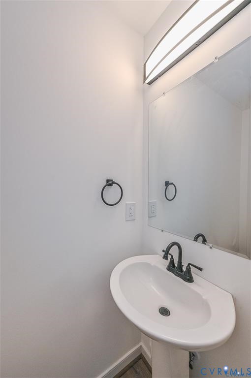 606 West Point Drive Ruther Glen, VA 22546 - Photo 14 of 30 a bathroom with a sink and mirror