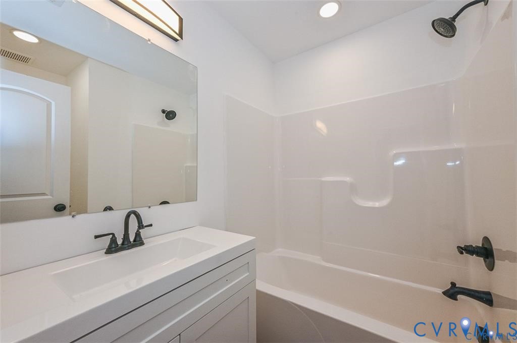 606 West Point Drive Ruther Glen, VA 22546 - Photo 23 of 30 a bathroom with a sink a toilet and a bathtub