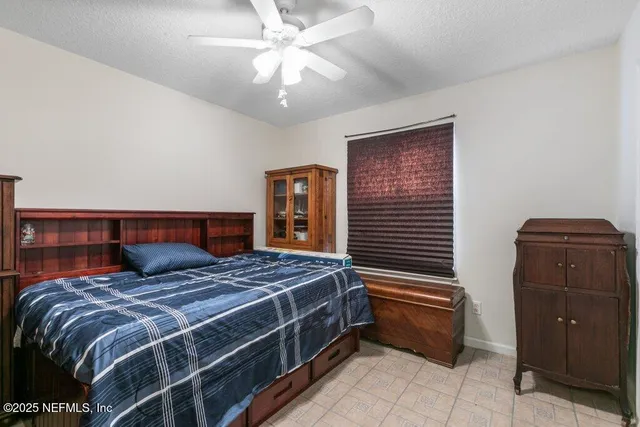 a bedroom with a bed and dresser